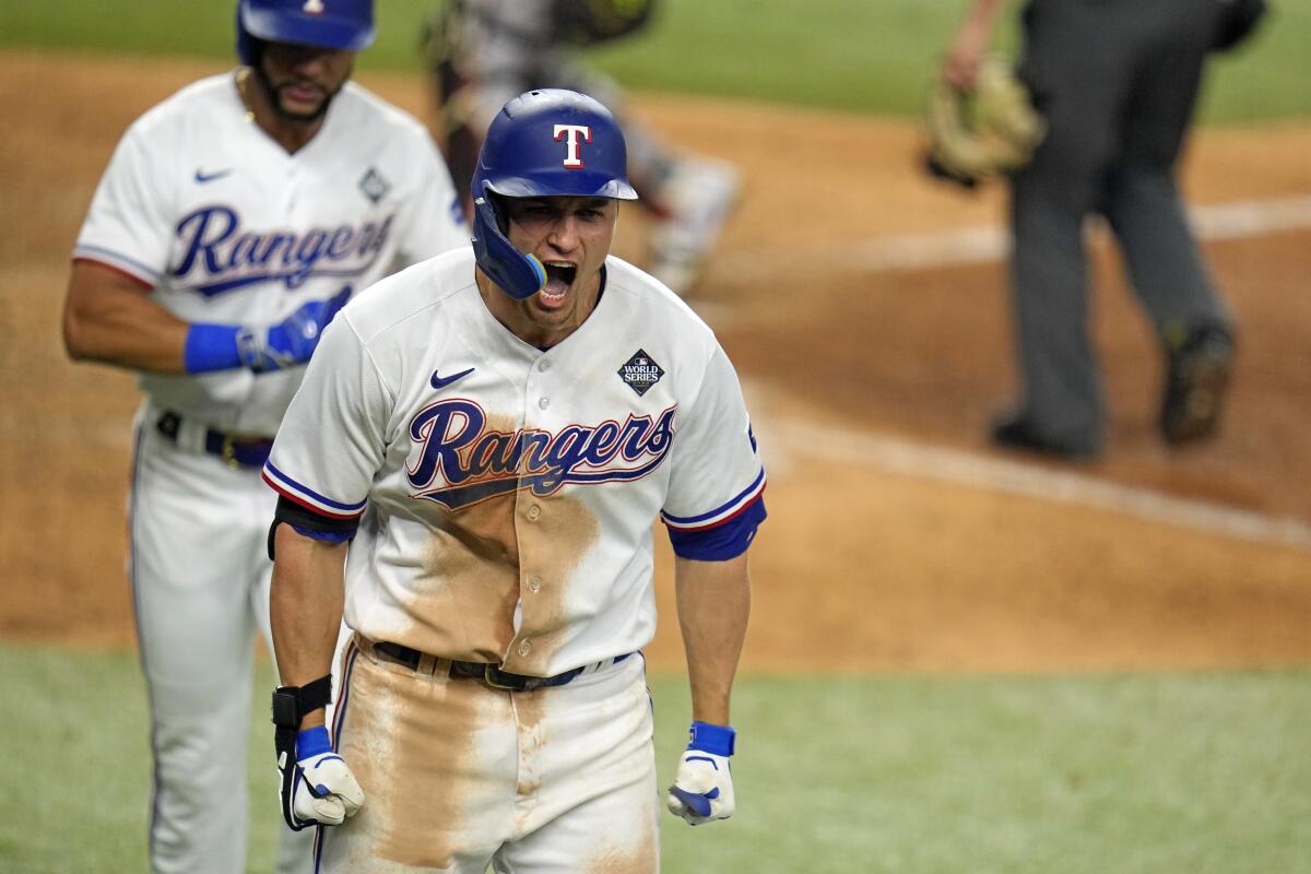 Corey Seager celebrates after tying the game on a two-run home run in the ninth inning of the Texas Rangers' comeback win.