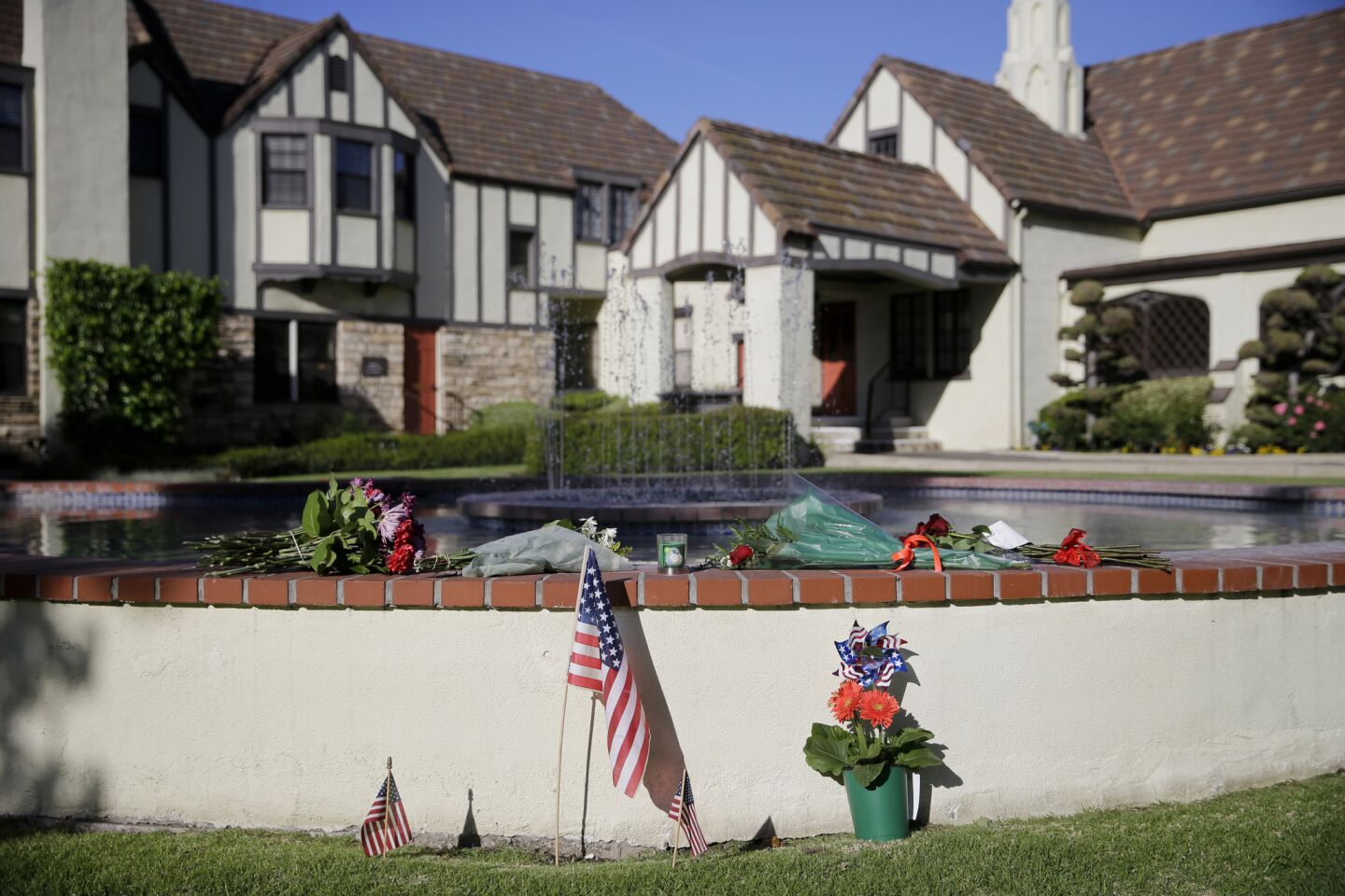 Flowers and flags decorate a fountain outside the mortuary where a small ceremony for former First Lady Nancy Reagan was held Wednesday in Santa Monica.