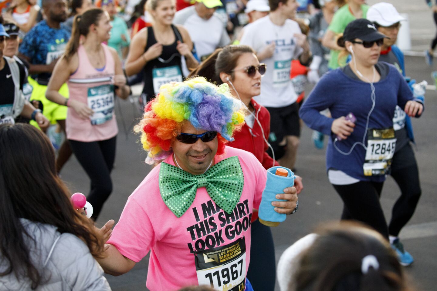 A runner in clown costume at the start of the L.A. Marathon at Dodger Stadium.