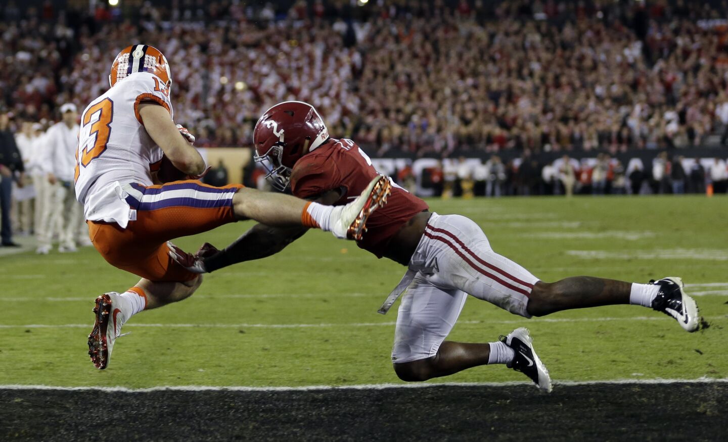 Clemson receiver Hunter Renfrow catches a two-yard touchdown pass against Alabama's Tony Brown during the final seconds of the fourth quarter to give the Tigers a 35-31 lead.