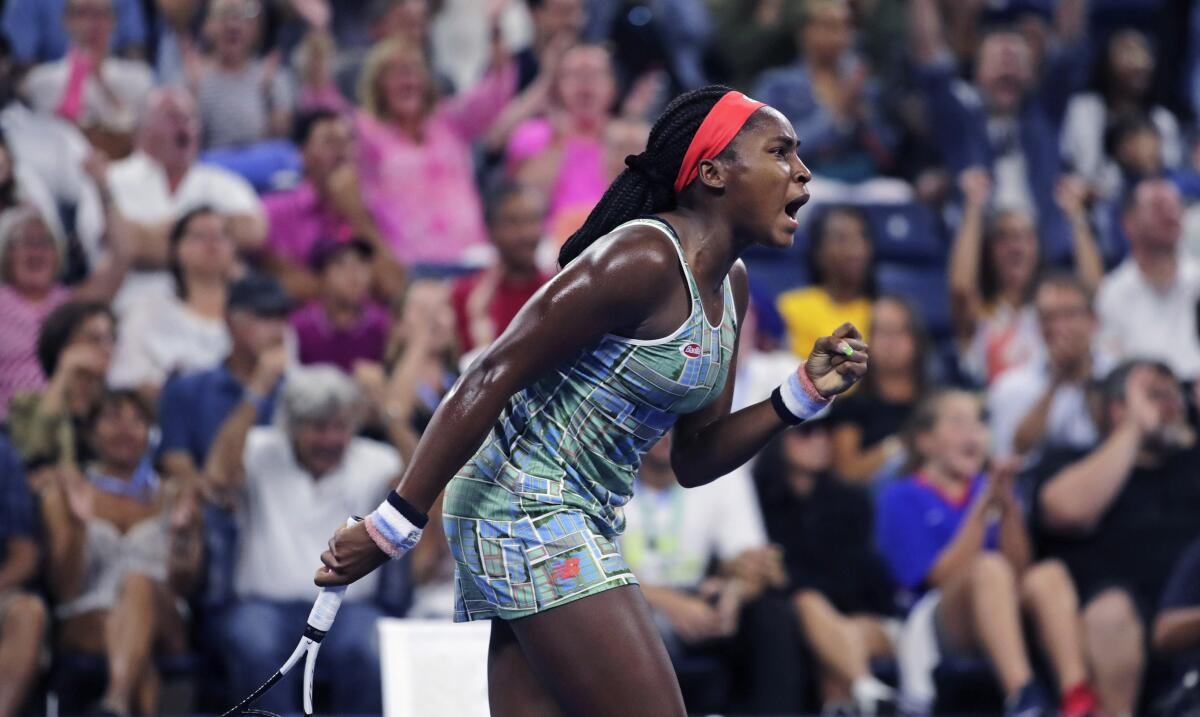 Coco Gauff pumps her fist after winning a point against Timea Babos during the second round of the U.S. Open.