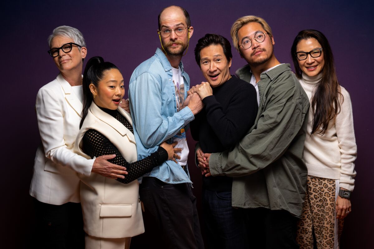 The directors and cast of "Everything Everywhere All at Once" gather together for a playful group portrait.