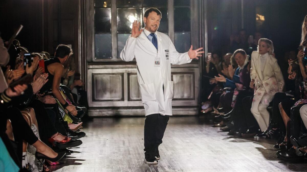 Johnson Hartig takes his runway bow after presenting his Libertine collection at the Wilshire Ebell in Los Angeles.
