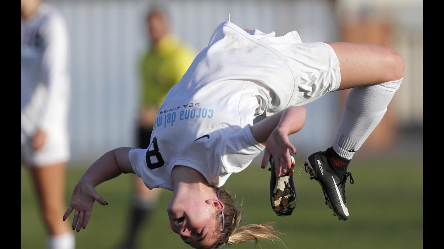 Corona del Mar High's Megan Chelf does a back flip after scoring during the first half against Laguna Beach in a nonleague match on Friday.