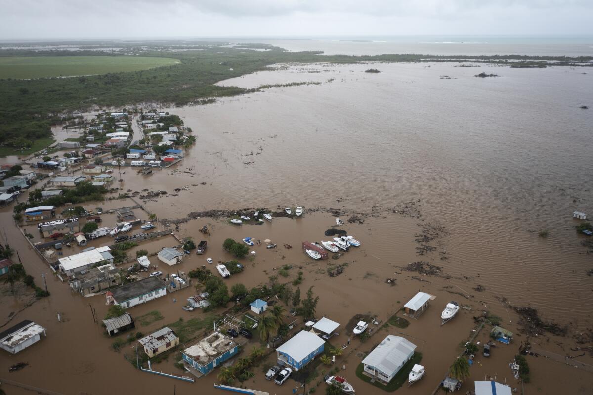 Homes are flooded on Salinas Beach after the passing of Hurricane Fiona in Salinas, Puerto Rico, on Monday.