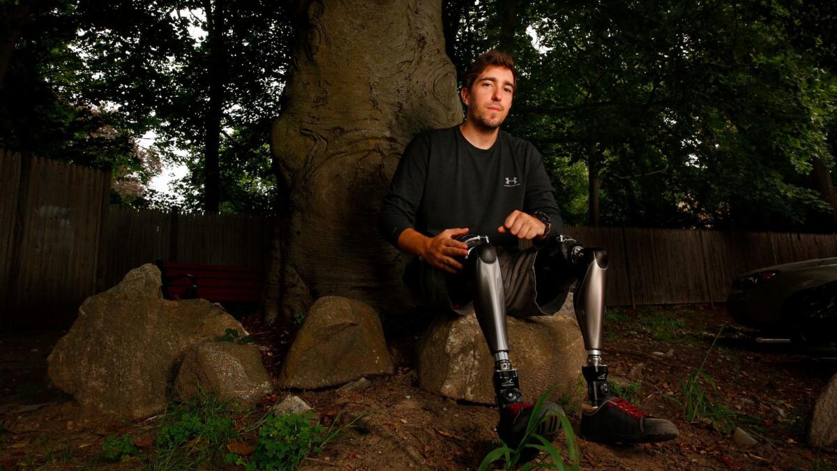 Bauman, seen here near his home in Concord, Mass., lost his legs during the Boston Marathon bombing.