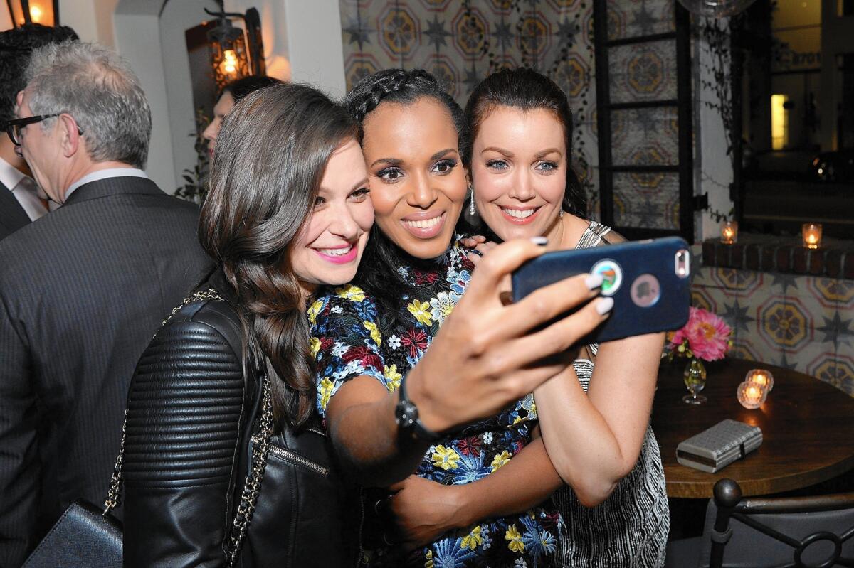 "Scandal" actresses Katie Lowes, Kerry Washington and Bellamy Young pose as Washington takes a selfie at a dinner celebrating her at A.O.C. on April 2.