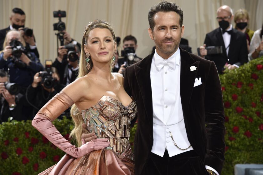 FILE - Blake Lively, left, and Ryan Reynolds attend The Metropolitan Museum of Art's Costume Institute benefit gala on Monday, May 2, 2022, in New York. Parties are back, and they've brought with them the potential for some dress code chaos. White tie, black tie, black tie creative/festive, semi-formal. Pre-pandemic guidelines for attire in an exhausted world more used to sweats and sneakers may take some extra re-entry energy. (Photo by Evan Agostini/Invision/AP, File)