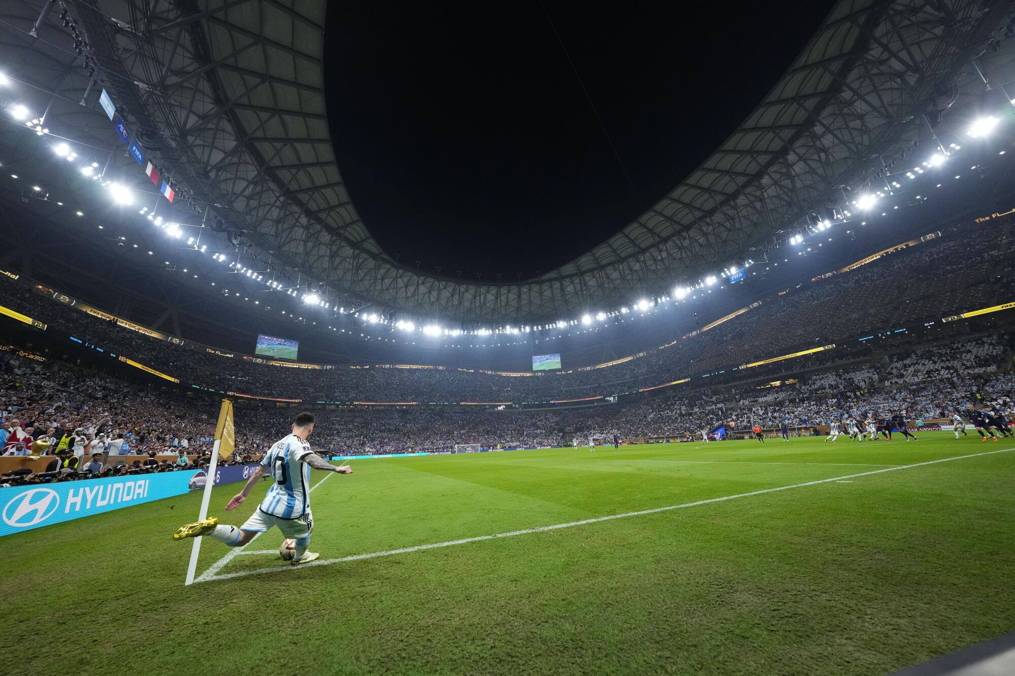 Argentina's Lionel Messi takes a corner kick during the World Cup final soccer match.
