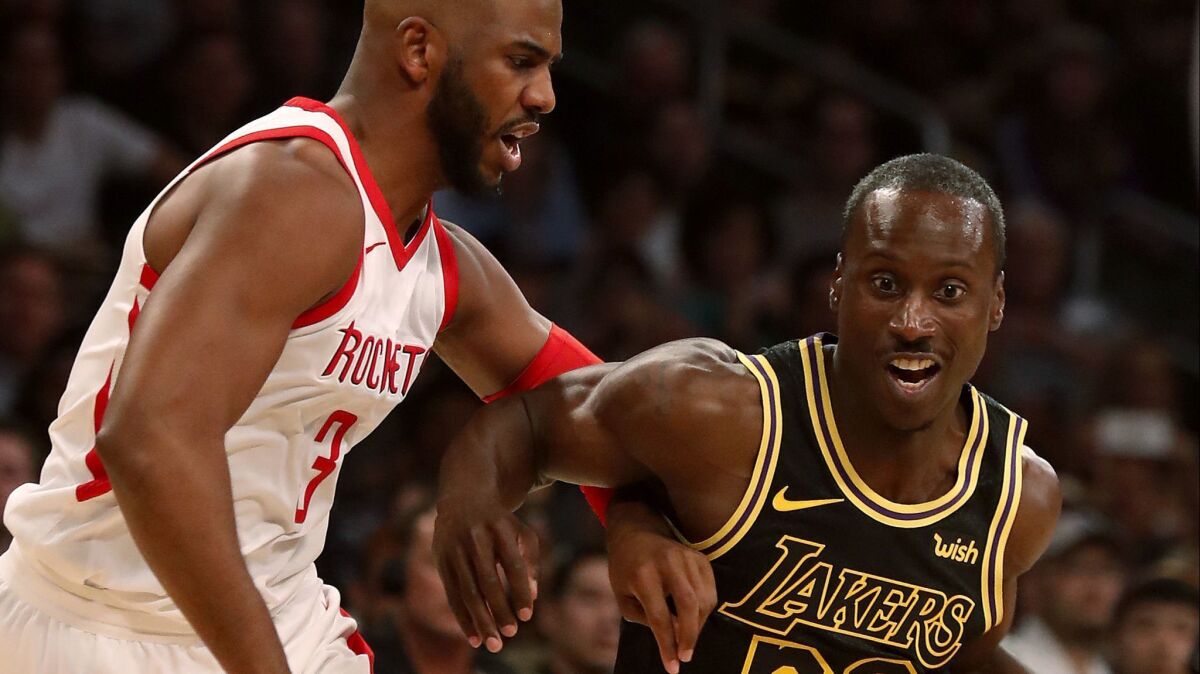 Andre Ingram drives to the basket against Rockets guard Chris Paul in the second quarter on April 10, 2018, at Staples Center.