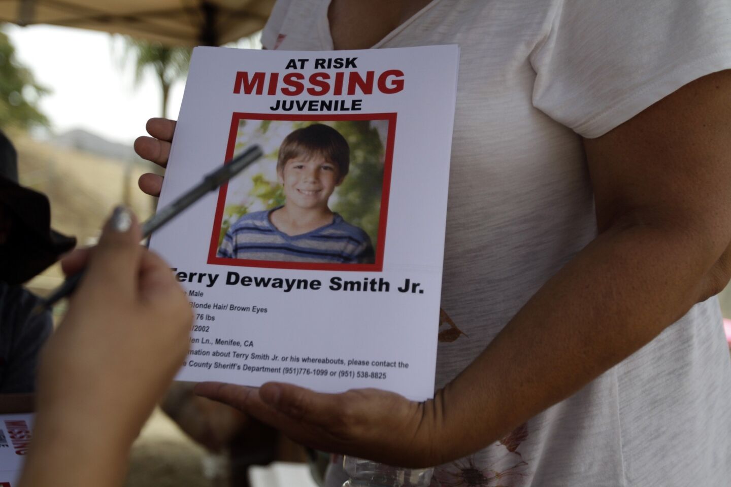 Fliers are passed out in the search for Terry Dewayne Smith.