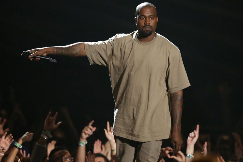 Kanye West accepts the Video Vanguard Award on Sunday at the MTV Video Music Awards at the Microsoft Theater in Los Angeles.