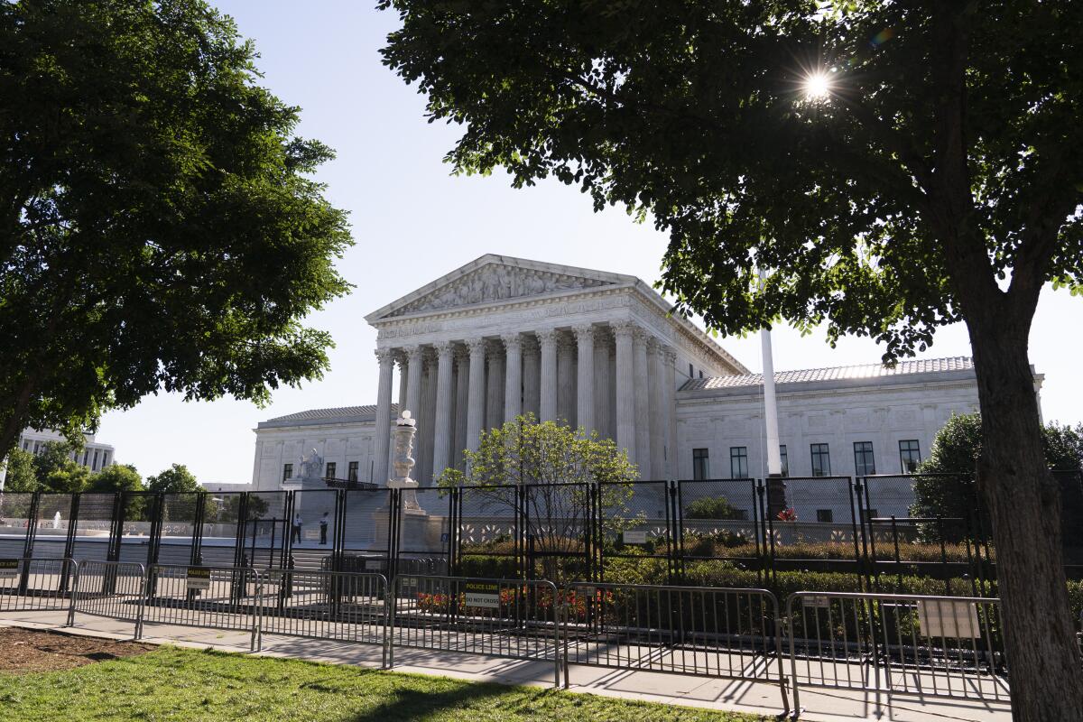 The U.S. Supreme Court behind fencing 