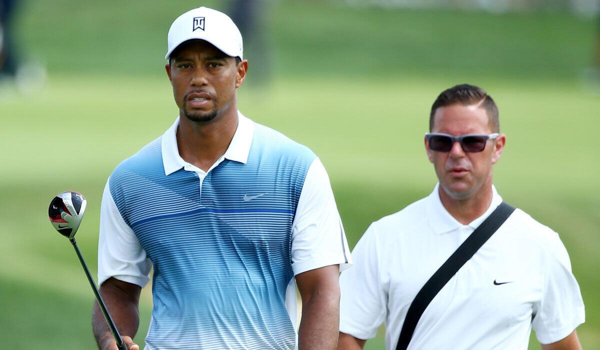 Tiger Woods walks with Sean Foley during a practice round prior to the start of the PGA Championship at Valhalla Golf Club in Louisville, Ky., on Aug. 6.