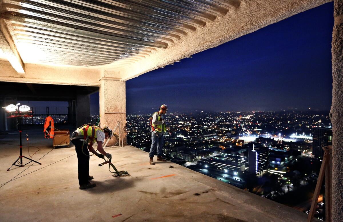 Carpenters work on the 51st floor of the Wilshire Grand Center in downtown Los Angeles in March. The skyscraper is to contain office space and hotel rooms.