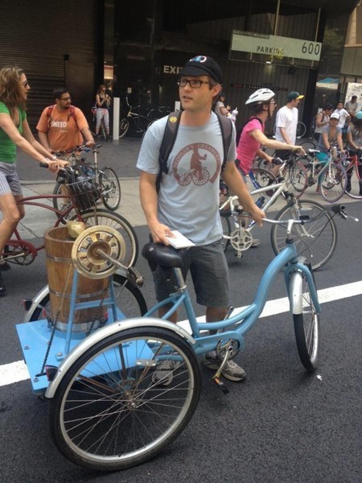 Edward Belden, who runs a downtown ice cream shop called Peddler's Creamery, gives out samples at CicLAvia.