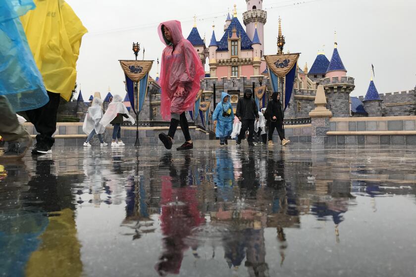 ANAHEIM CA. MARCH 12, 2020 - A combination of weather and the coronavirus kept crowds sparse at Disneyland on Thursday, March 12, 2020. (Allen J. Schaben / Los Angeles Times)