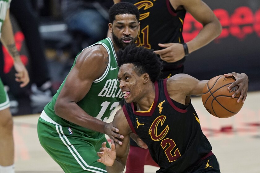 Cleveland Cavaliers' Collin Sexton (2) drives against Boston Celtics' Tristan Thompson (13) during the second half of an NBA basketball game Wednesday, May 12, 2021, in Cleveland. (AP Photo/Tony Dejak)