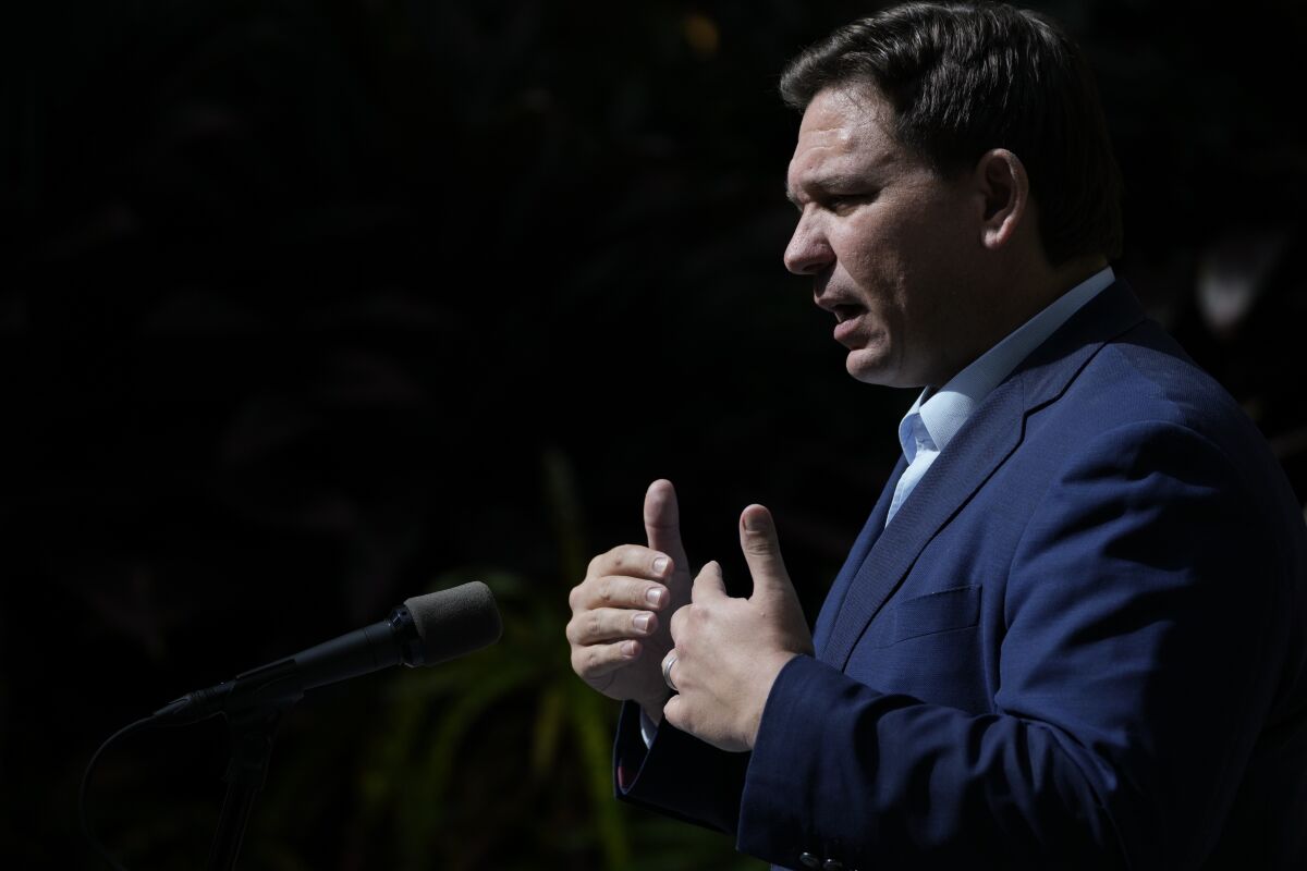 FILE - Florida Gov. Ron DeSantis speaks during a news conference at Vizcaya Museum and Gardens, Tuesday, Feb. 1, 2022, in Miami. The Florida Supreme Court told DeSantis on Thursday, Feb. 9, it will not answer his question on whether a Black congressman's district is unconstitutional. (AP Photo/Rebecca Blackwell, File)