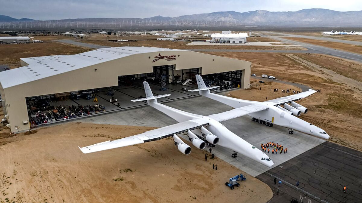 Paul Allen's Stratolaunch airplane emerges from its hangar in Mojave, Calif. on May 31, 2017.