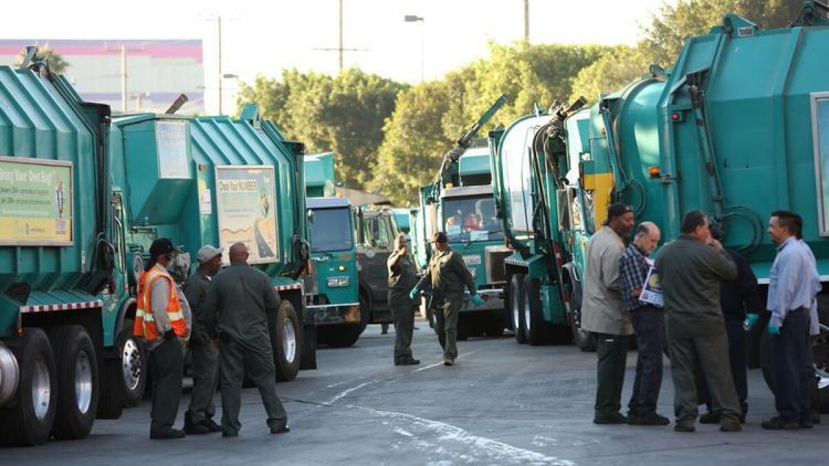 Sanitation workers gather last month at a demonstration in Boyle Heights over stalled contract negotiations.