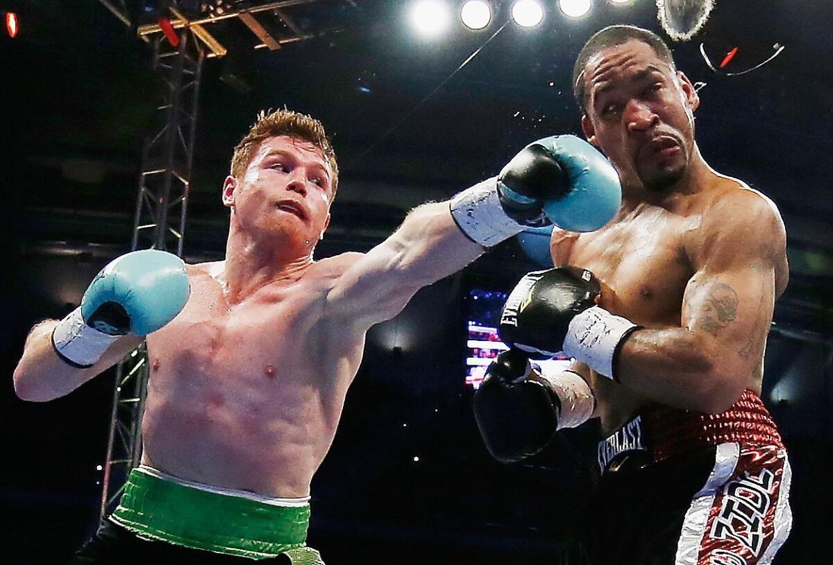 Saul 'Canelo' Alvarez delivers a punch to James Kirkland at Minute Maid Park on Saturday night.