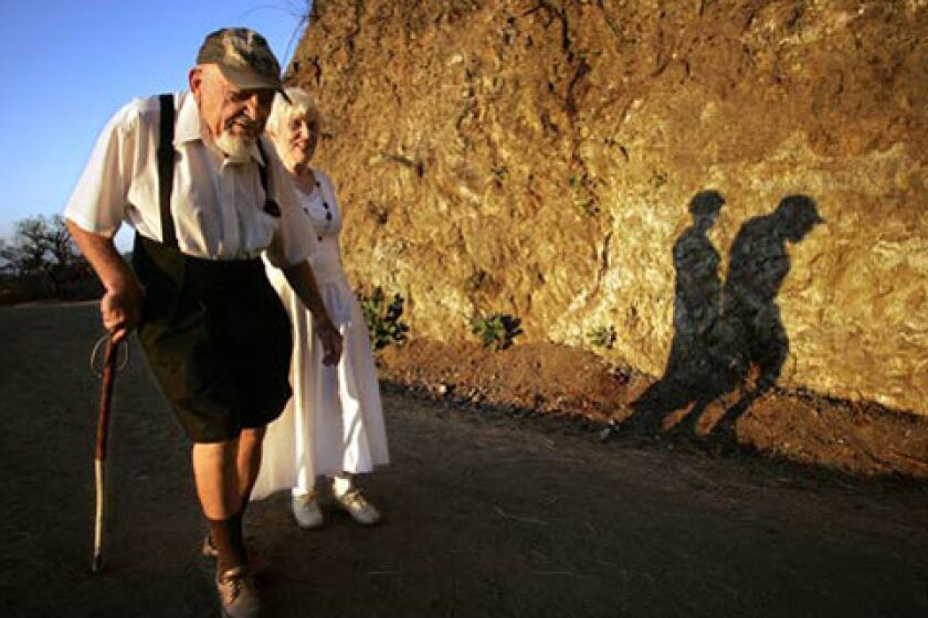 Sol Shankman, 93, and his companion, Anneliese Clay, 81, walk along Griffith Park's Riverside Trail, east of the Greek Theatre. He began hiking in the park in 1976 after suffering from angina. At first, it was principally therapeutic, he says. But I just kept on walking. Shankman has been walking pretty much every day since then  42,000 miles, by his reckoning,
