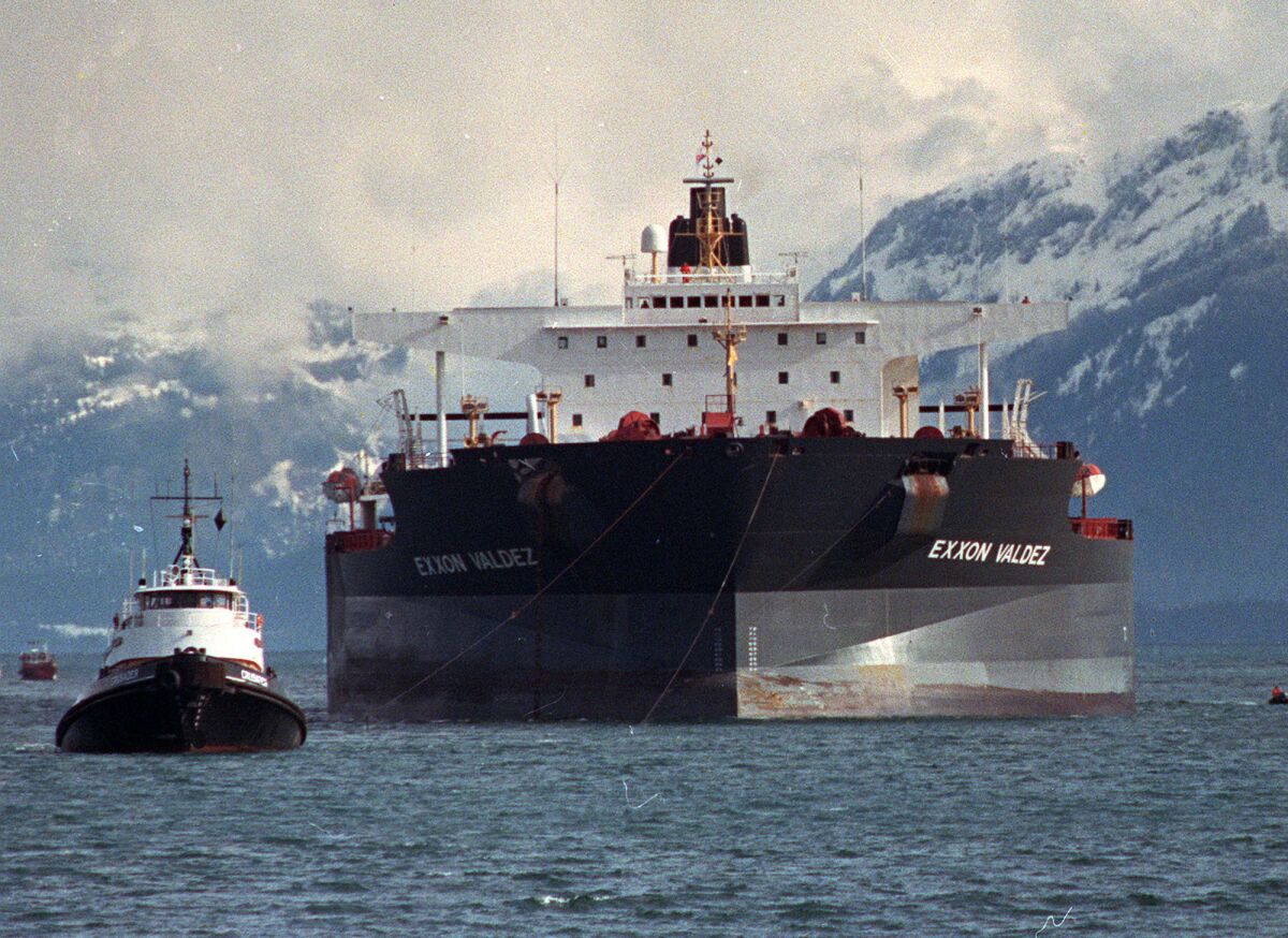 Tugboats pull the crippled tanker Exxon Valdez toward Naked Island in Prince William Sound, Alaska, in this April 5, 1989, photo.
