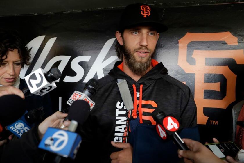 San Francisco Giants pitcher Madison Bumgarner answers questions about his shoulder injury before a baseball game against the Los Angeles Dodgers, Monday, April 24, 2017, in San Francisco . (AP Photo/Marcio Jose Sanchez)