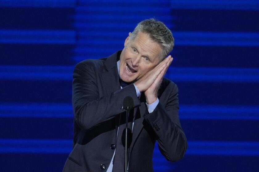 Team USA Men's Basketball coach and Golden State Warriors coach Steve Kerr speaks during the Democratic National Convention Monday, Aug. 19, 2024, in Chicago. (AP Photo/J. Scott Applewhite)