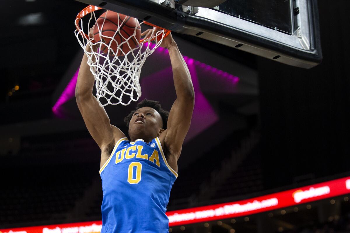 UCLA guard Jaylen Clark dunks against Bellarmine during the first half.