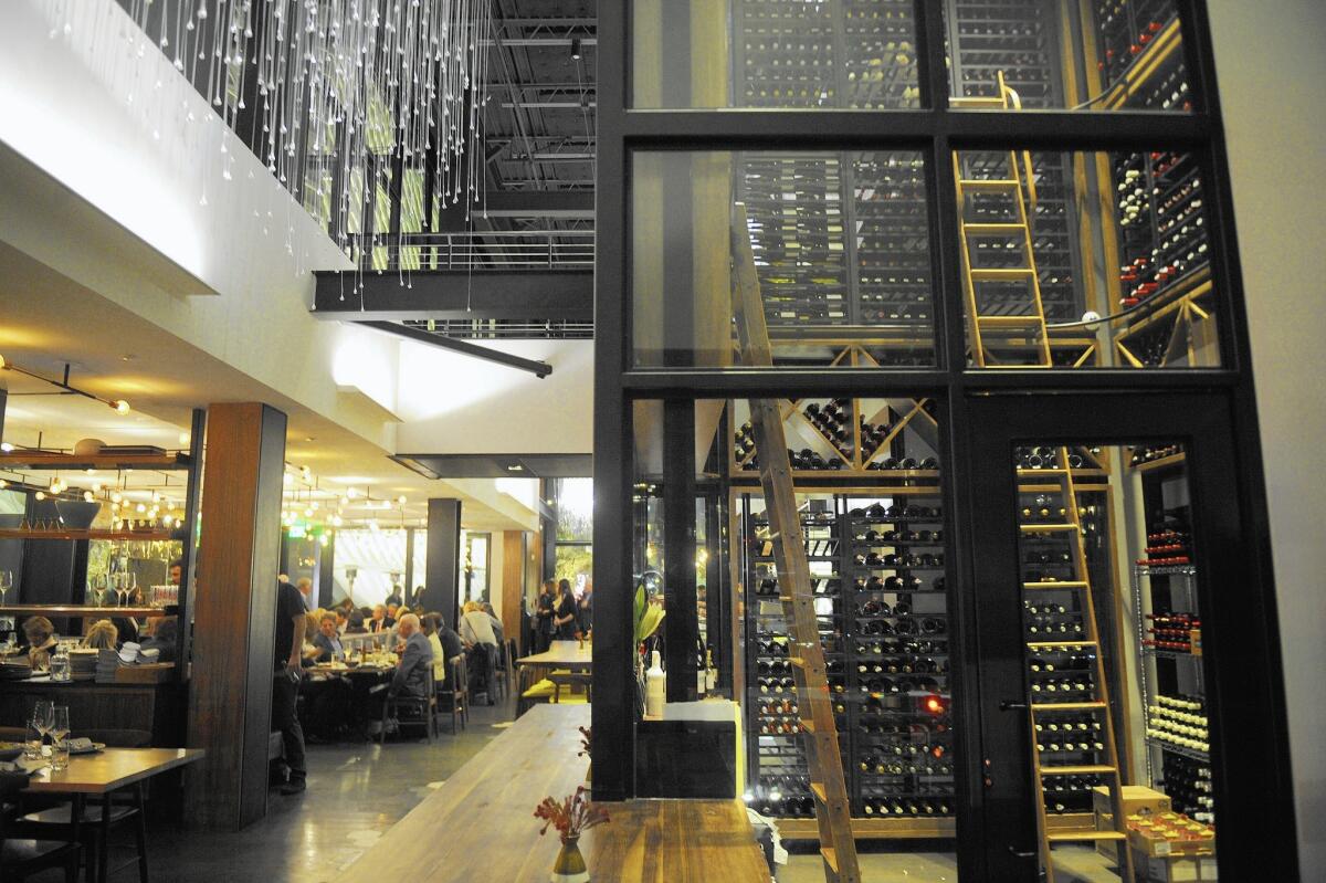 The above-ground, glass-walled wine cellar at Otium is the downtown restaurant’s centerpiece and features a large selection.