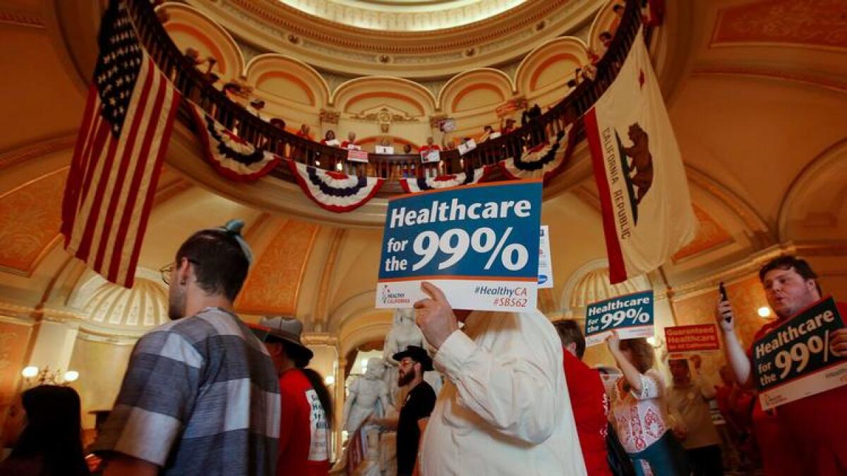 Members of the California Nurses Assn. and other supporters rally at the state Capitol for a single-payer health plan June 28.