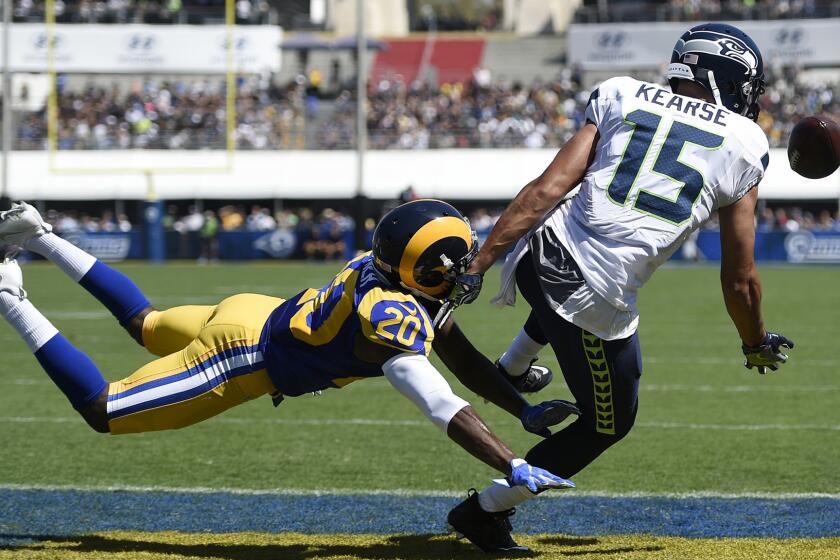 Rams cornerback Lamarcus Joyner prevents a reception by the Seahawks' Jermaine Kearse in the end zone at the Coliseum on Sept. 18.