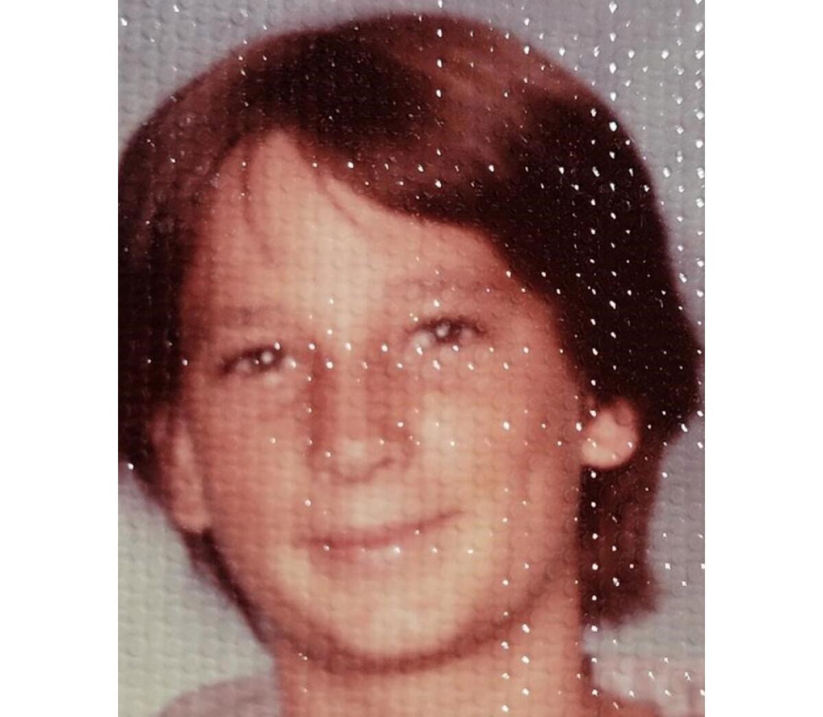 Closeup of a teen boy smiling.