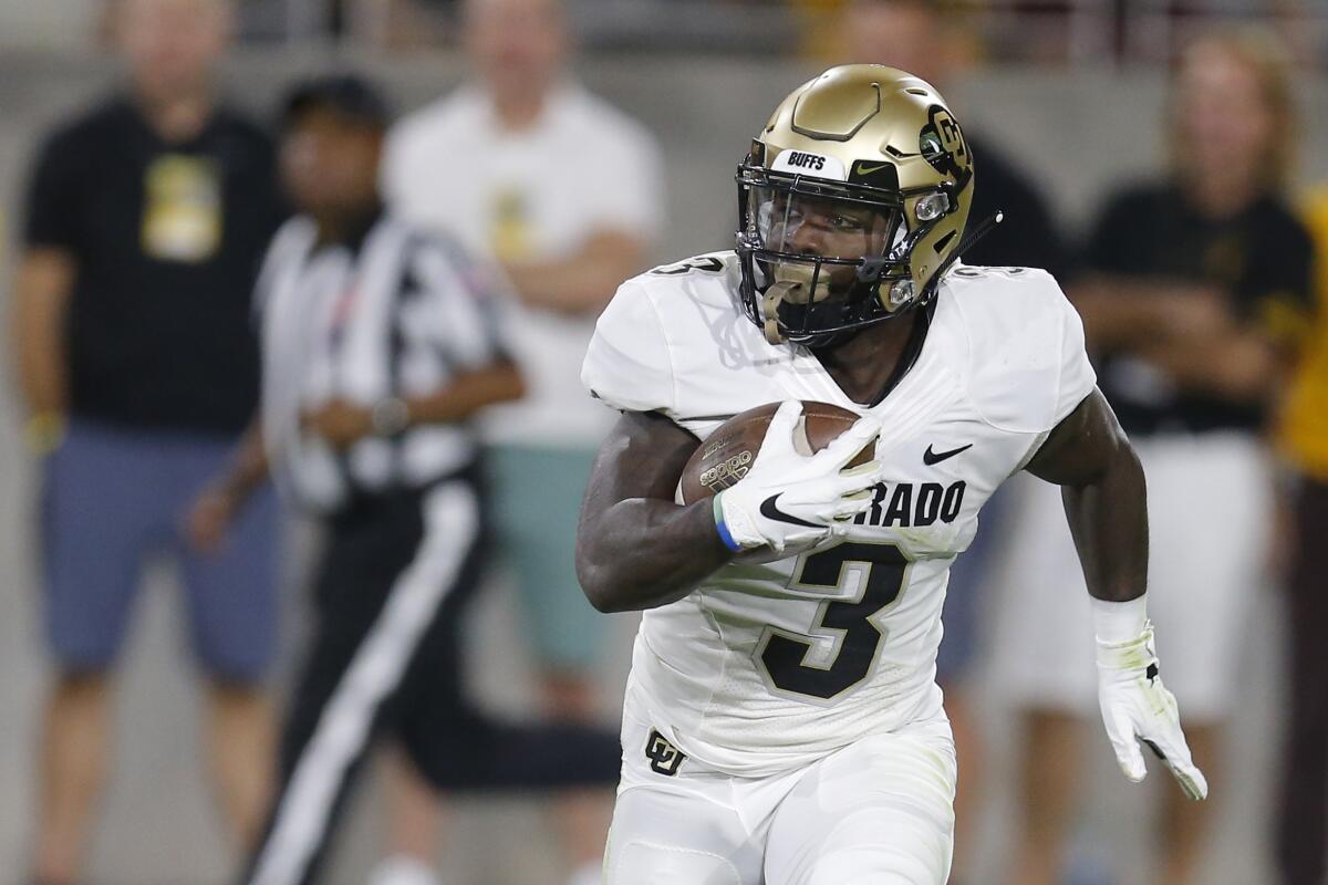 Colorado wide receiver K.D. Nixon carries the ball in a game against Arizona State.