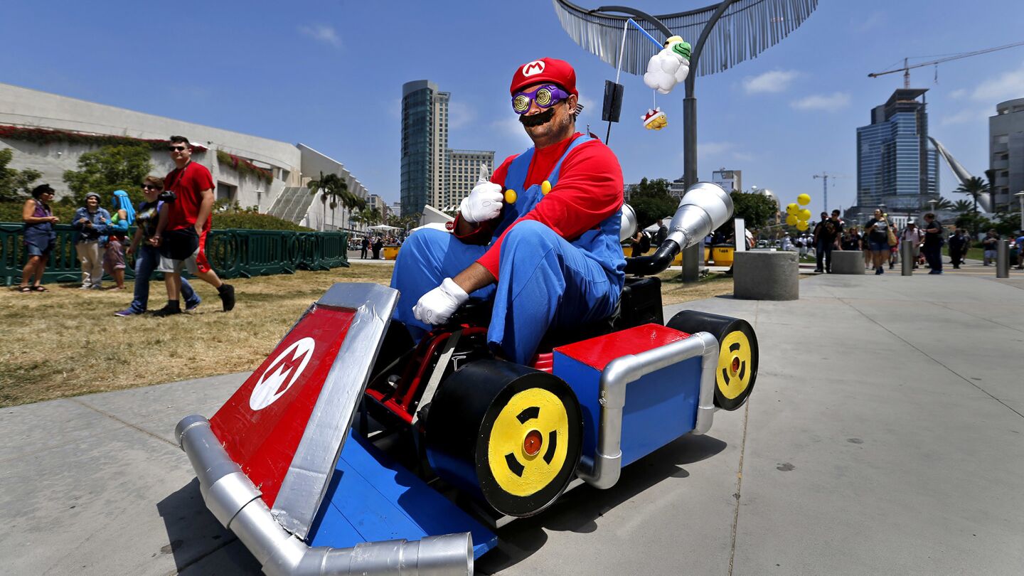 Vince Idos of San Diego drives his electric Mario kart outside Comic-Con 2017 on Saturday.