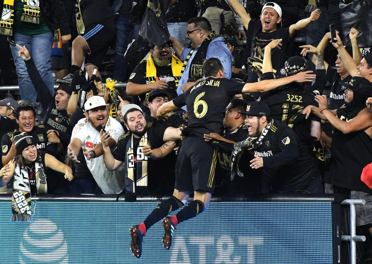 Defender Danilo Silva celebrates with fans at Banc of California Stadium last season.