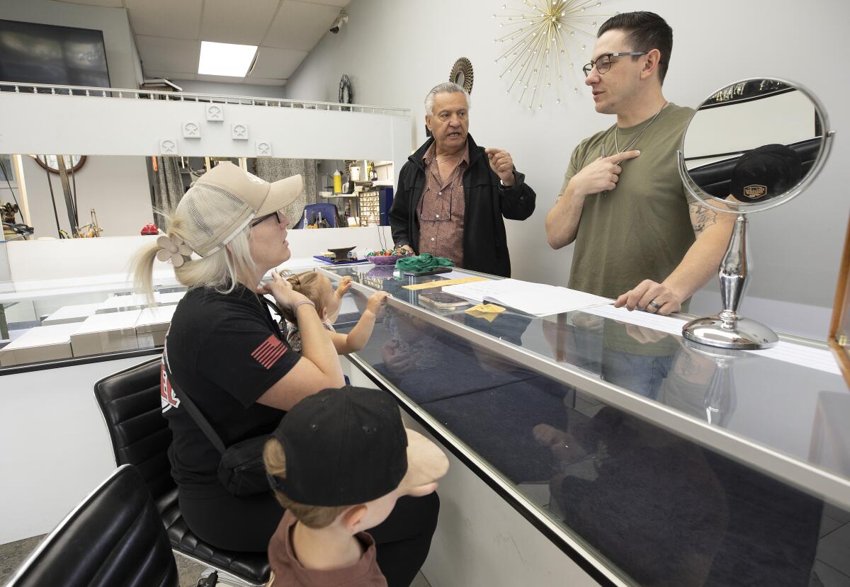 Jacoub and Jonathan Youssef decide on a design with a customer, who lost a necklace in a safe where all items were stolen.
