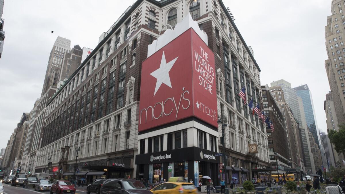 Traffic makes its way past the Macy's flagship store in New York on May 16.