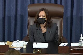 In this image from Senate TV, Vice President Kamala Harris sits in the chair on the Senate floor to cast the tie-breaking vote, her first, Friday, Feb. 5, 2021 at the Capitol in Washington. The Senate early Friday approved a budget resolution that paves the way for fast-track passage of President Joe Biden's $1.9 trillion coronavirus relief plan without support from Republicans. (Senate TV via AP)