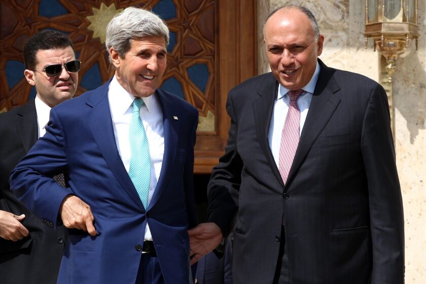 Secretary of State John F. Kerry, left, and Egyptian Foreign Minister Sameh Shoukry talk after their press conference following a meeting with Egyptian President Abdel Fattah Sissi in Cairo on Tuesday.