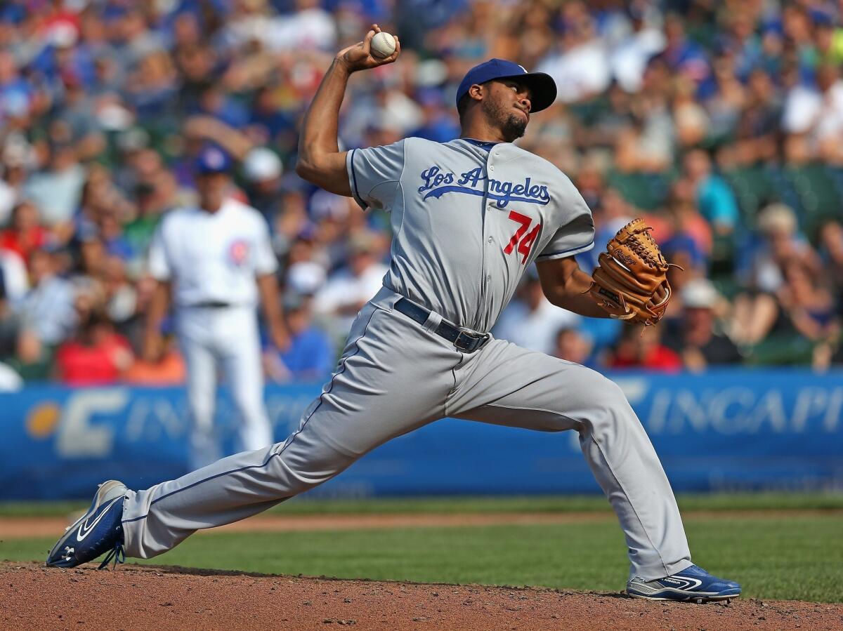 Dodgers closer Kenley Jansen delivers a pitch in the ninth inning of the Dodgers' 1-0 victory over the Chicago Cubs on Sunday.
