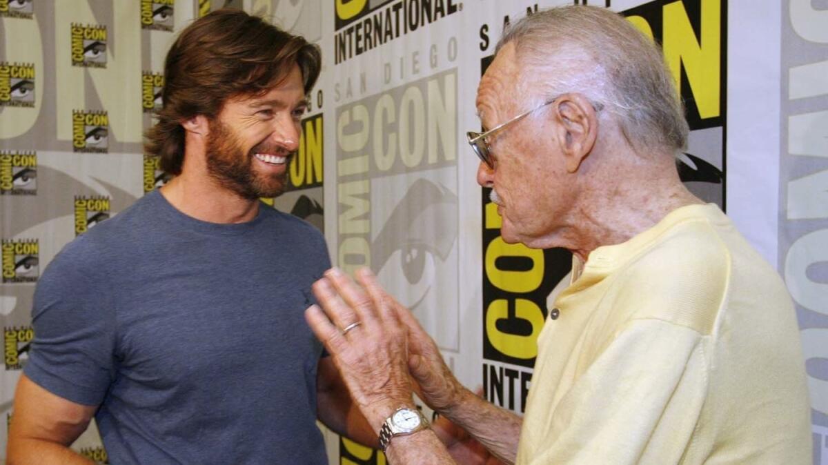 Hugh Jackman, left, talks to the late Stan Lee in 2008 at San Diego Comic-Con International.