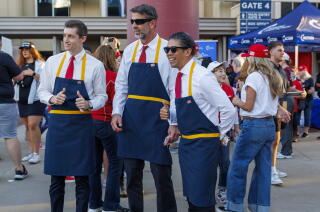 Donald Trump supporters dress as a McDonald's workers while waiting to enter a Trump event in Glendale, Ariz., last month.