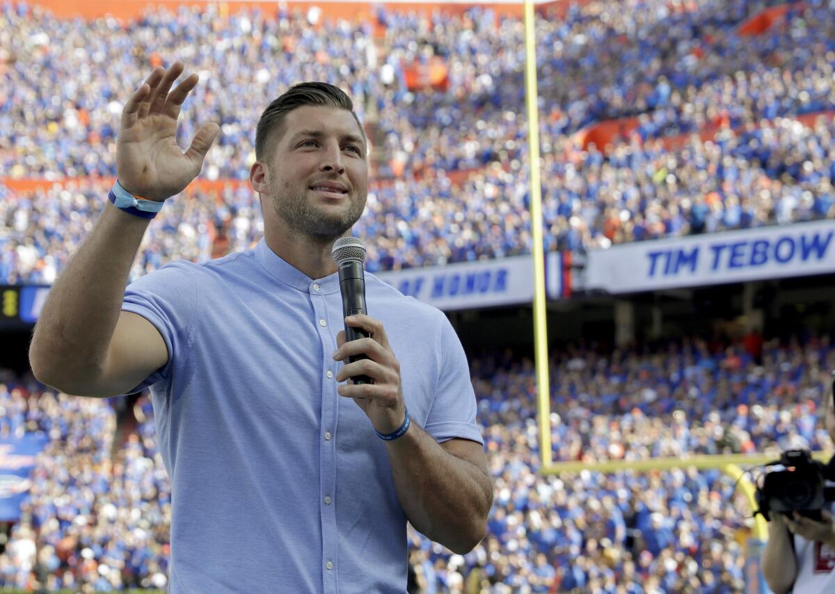 Tim Tebow speaks to fans after he was inducted into the Florida Gators' ring of honor Oct. 6, 2018, in Gainesville, Fla.