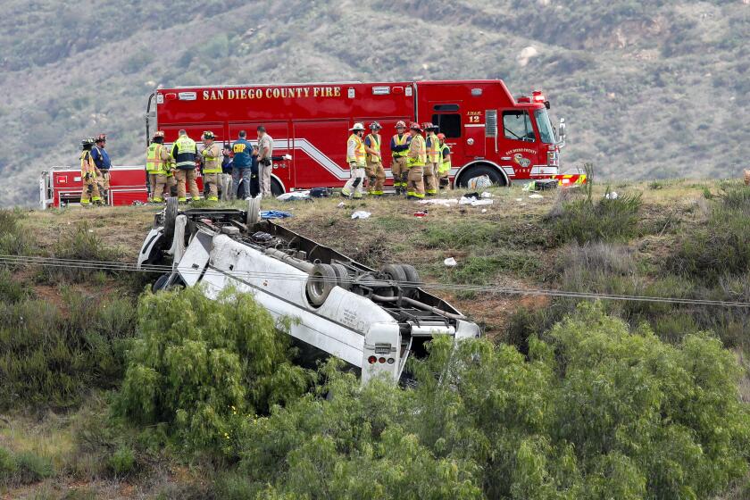 A bus rolled down an embankment off Interstate 15 in North County Saturday morning, killing three people and injuring 19 others. The crash occurred in the southbound lanes south of state Route 76 about 10:30 a.m., according to the North County Fire Protection District. Ñ photo by Don Boomer