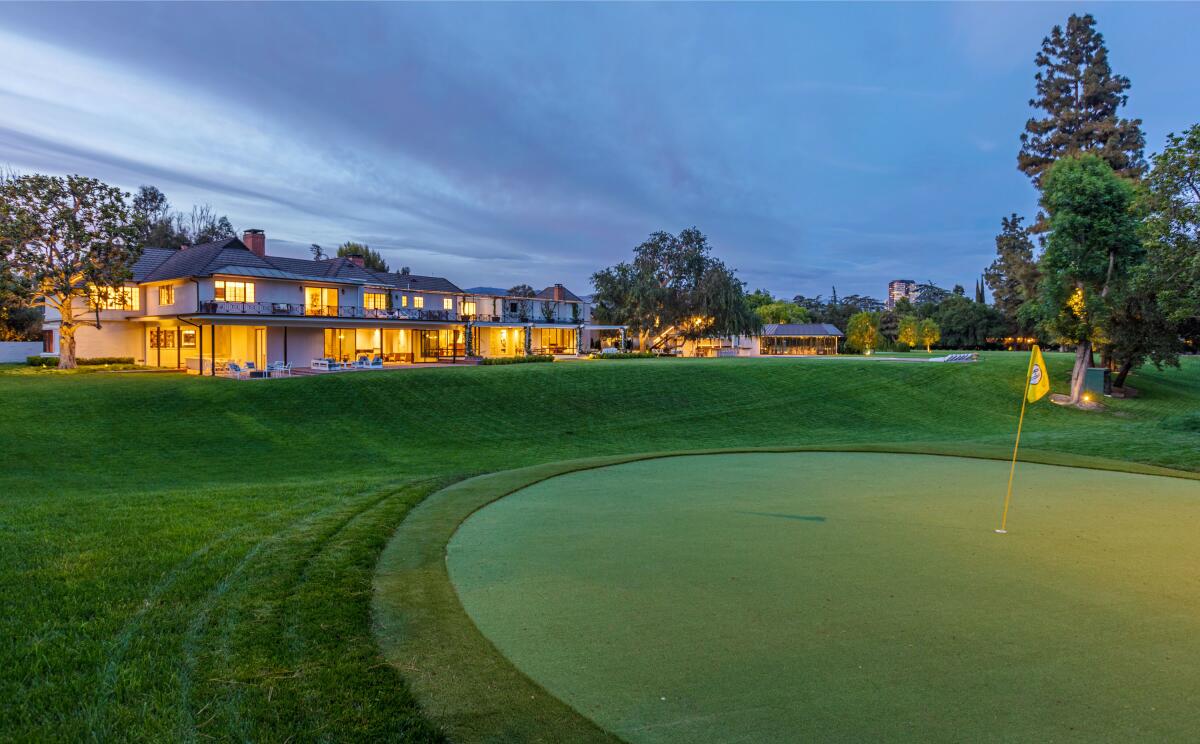 The 5-acre estate comes with a one-hole golf course.