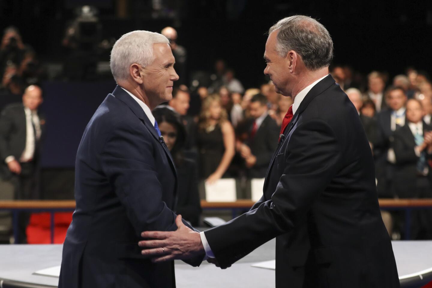 Republican vice-presidential nominee Gov. Mike Pence and Democratic vice-presidential nominee Sen. Tim Kaine shake hands after the vice-presidential debate at Longwood University in Farmville, Va., Tuesday, Oct. 4, 2016.
