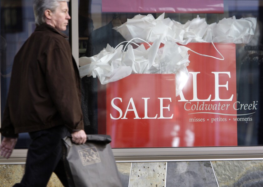 A shopper walks past a Coldwater Creek store in downtown Seattle.